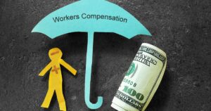 Paper cut out of an umbrella and stick figure. Symbolizing the shelter workers comp insurance brings.